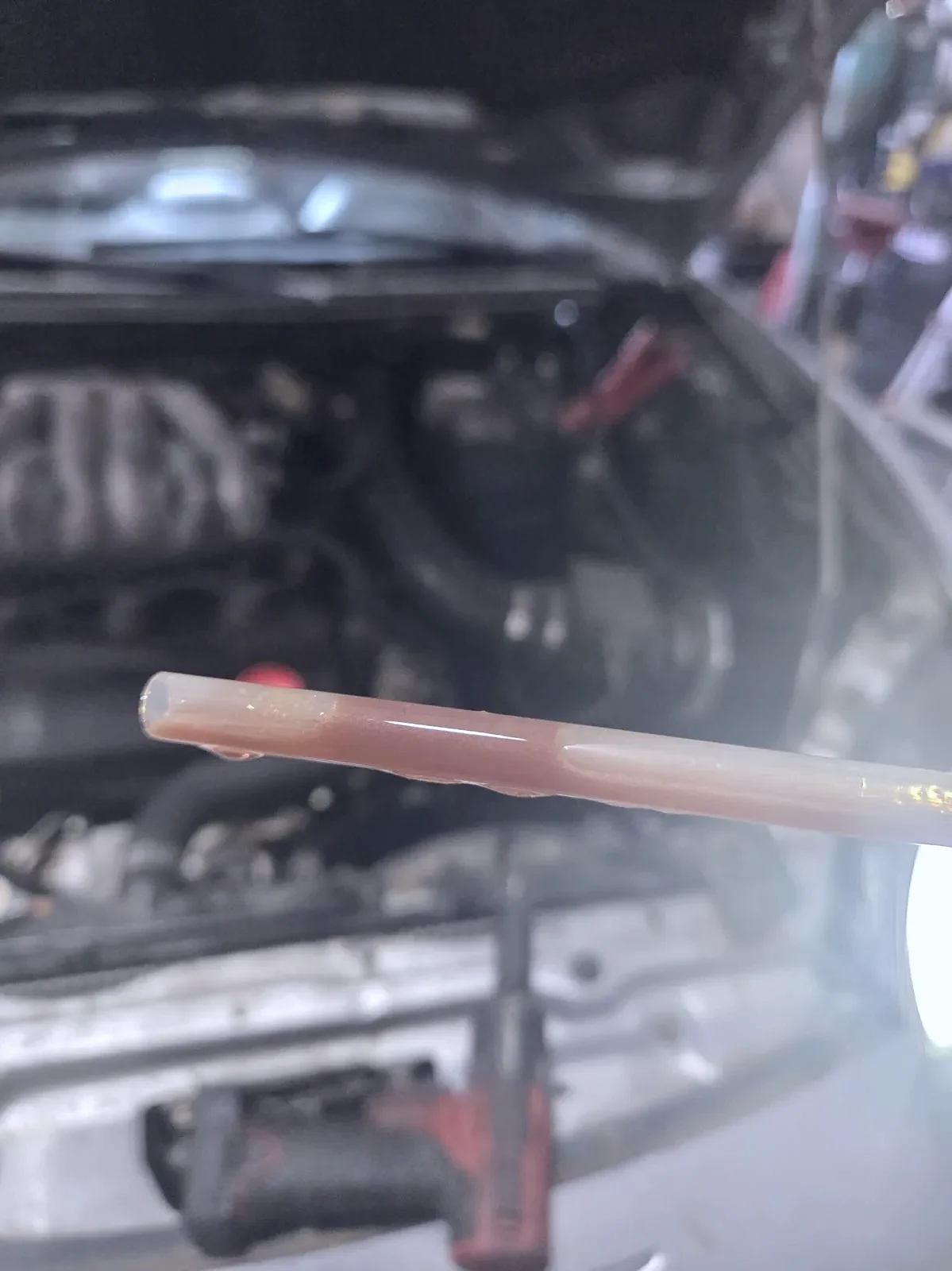 Checking oil level and condition during a lube service in Jerome, Idaho