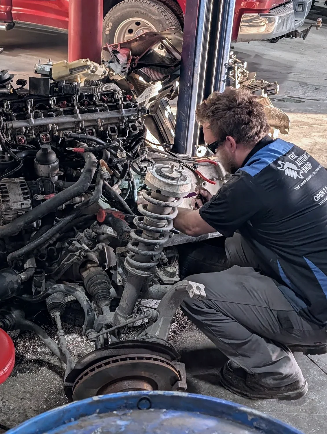 A technician in uniform on an engine teardown in Jerome, Idaho