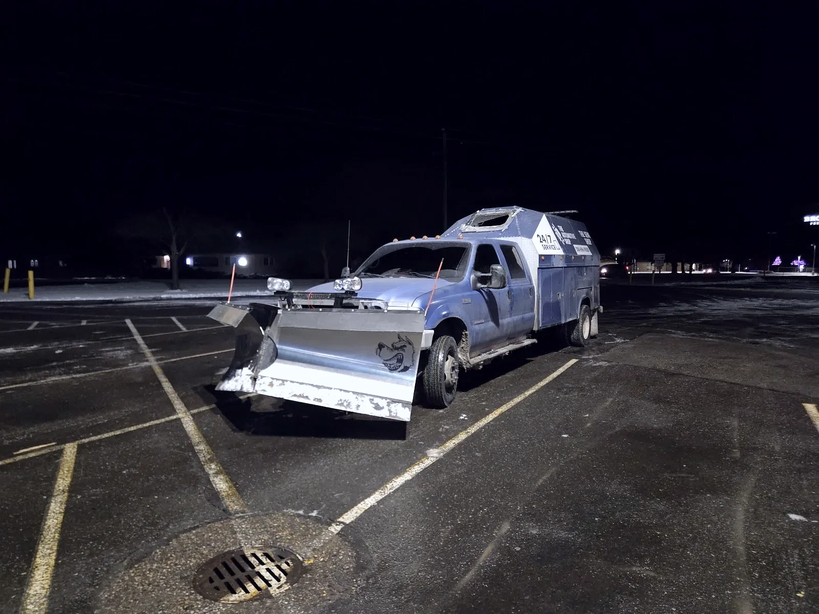 The Automotive Shop 24/7 service truck with snow plow