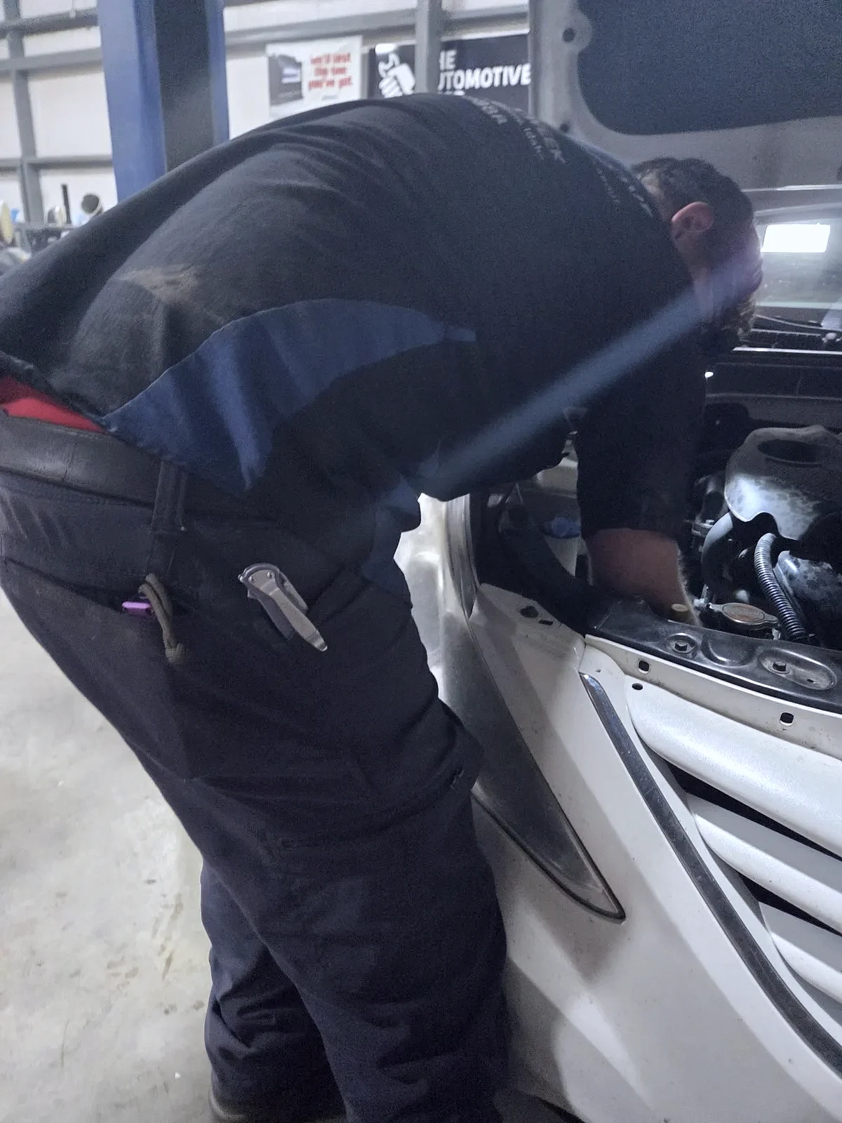 A technician performing fluid service in Jerome, Idaho